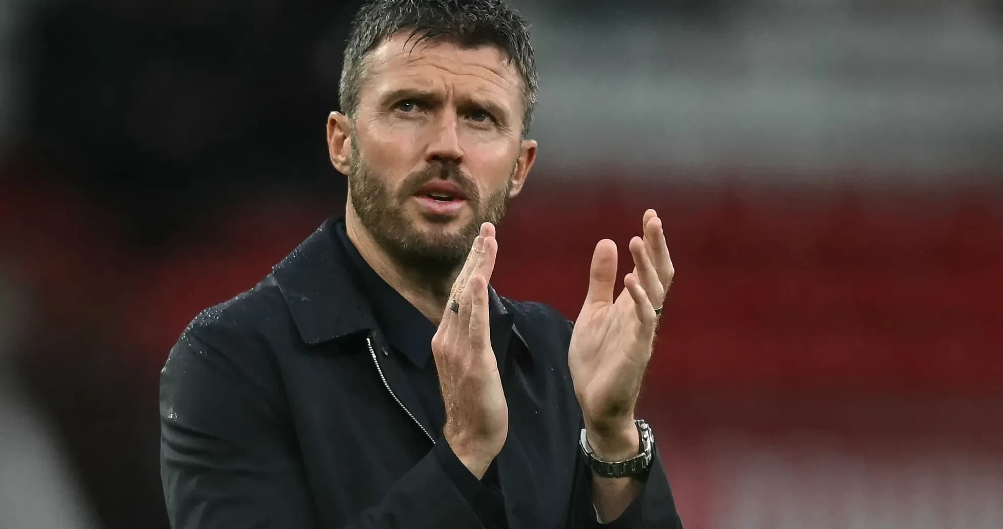 Coach applauding during match at stadium