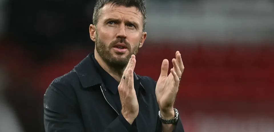 Coach applauding during match at stadium