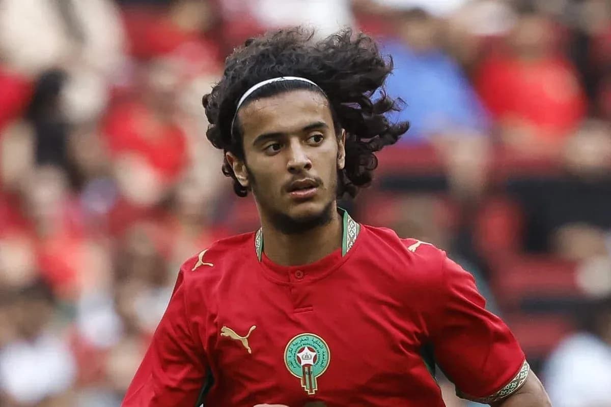 Player in red jersey running on the field