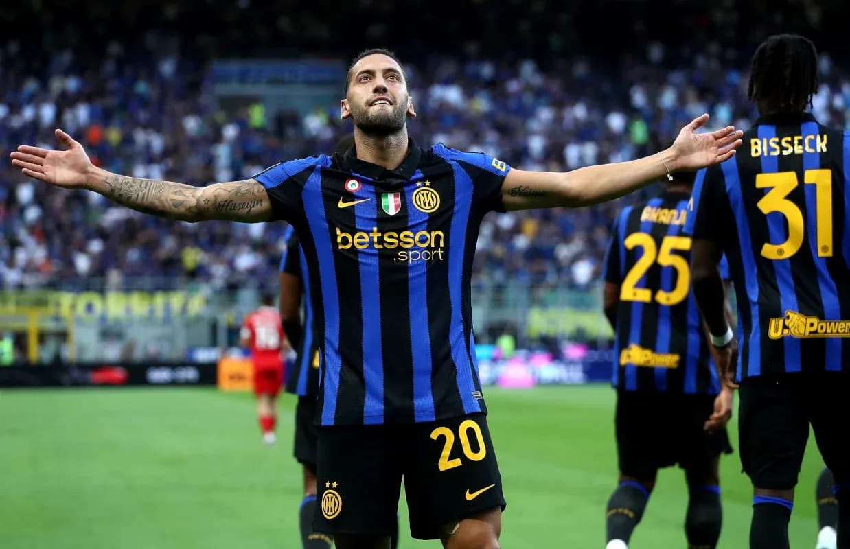 Player celebrating a goal with teammates on field