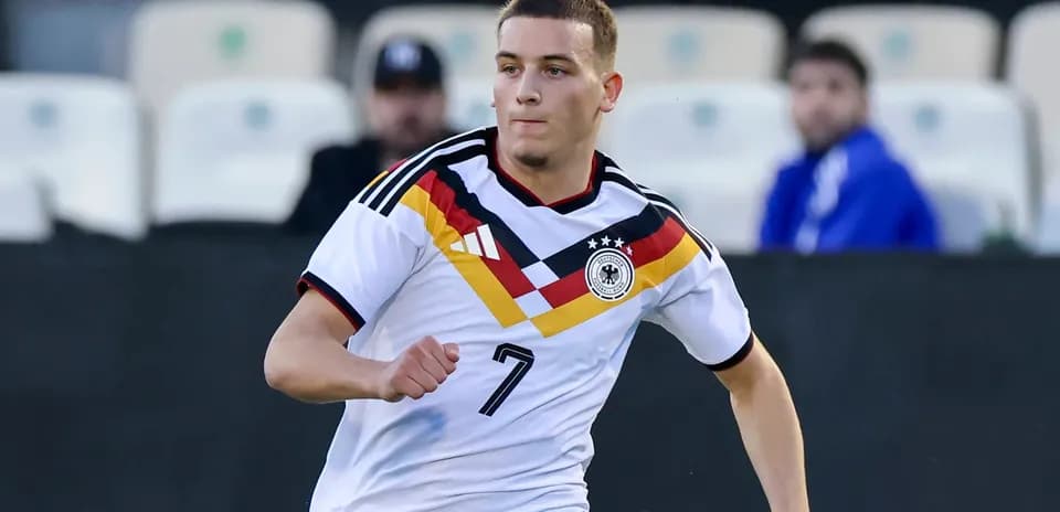 Player wearing Germany kit running during match