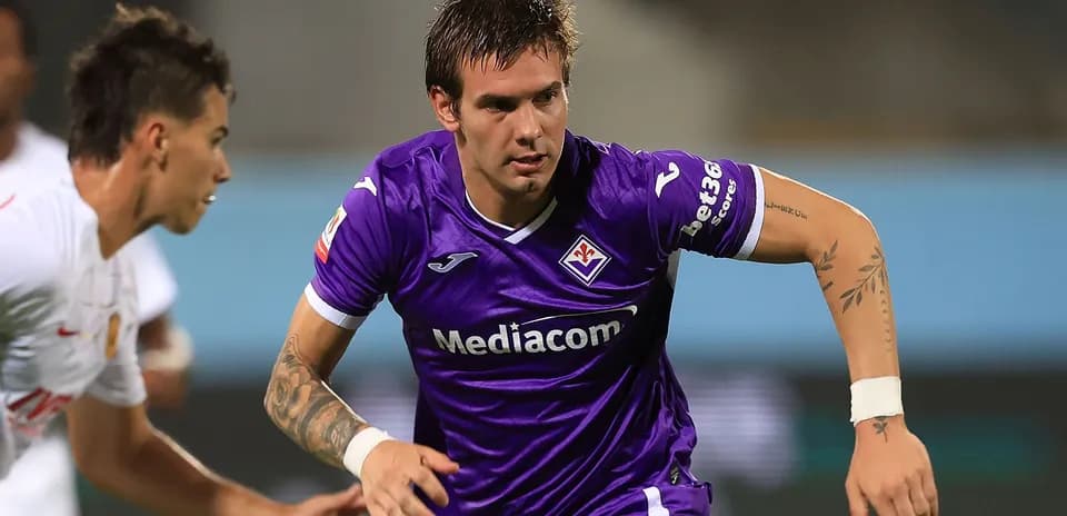 Player in purple jersey running during match