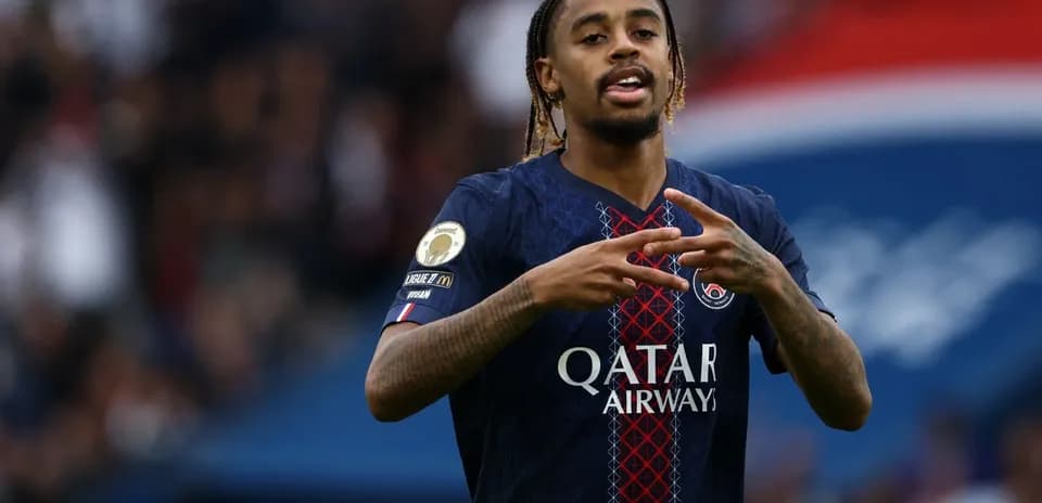 Player celebrating in PSG jersey during match