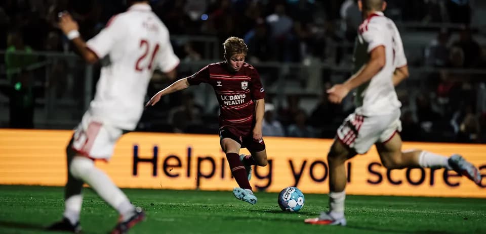 Player dribbling the ball in USL match