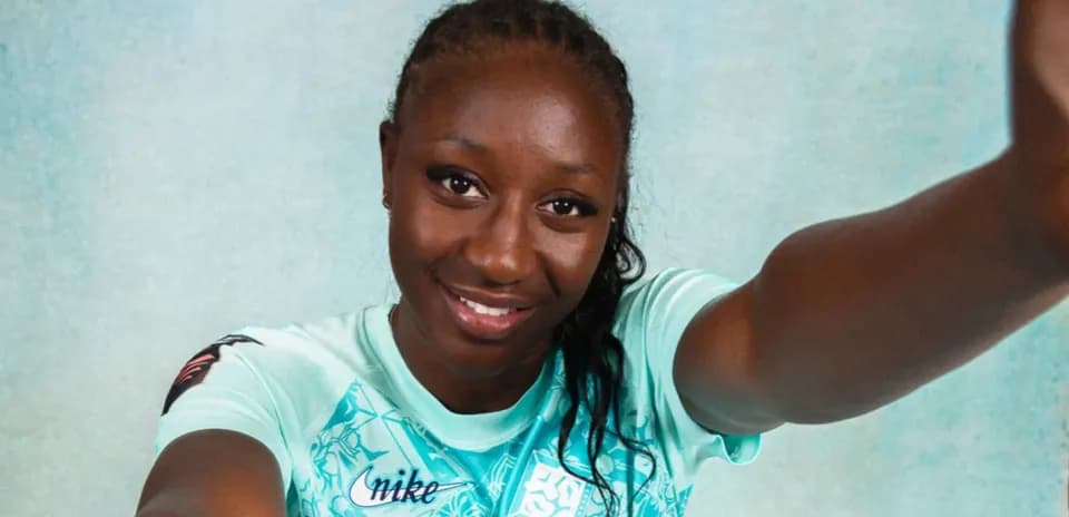Athlete posing in mint green sports jersey