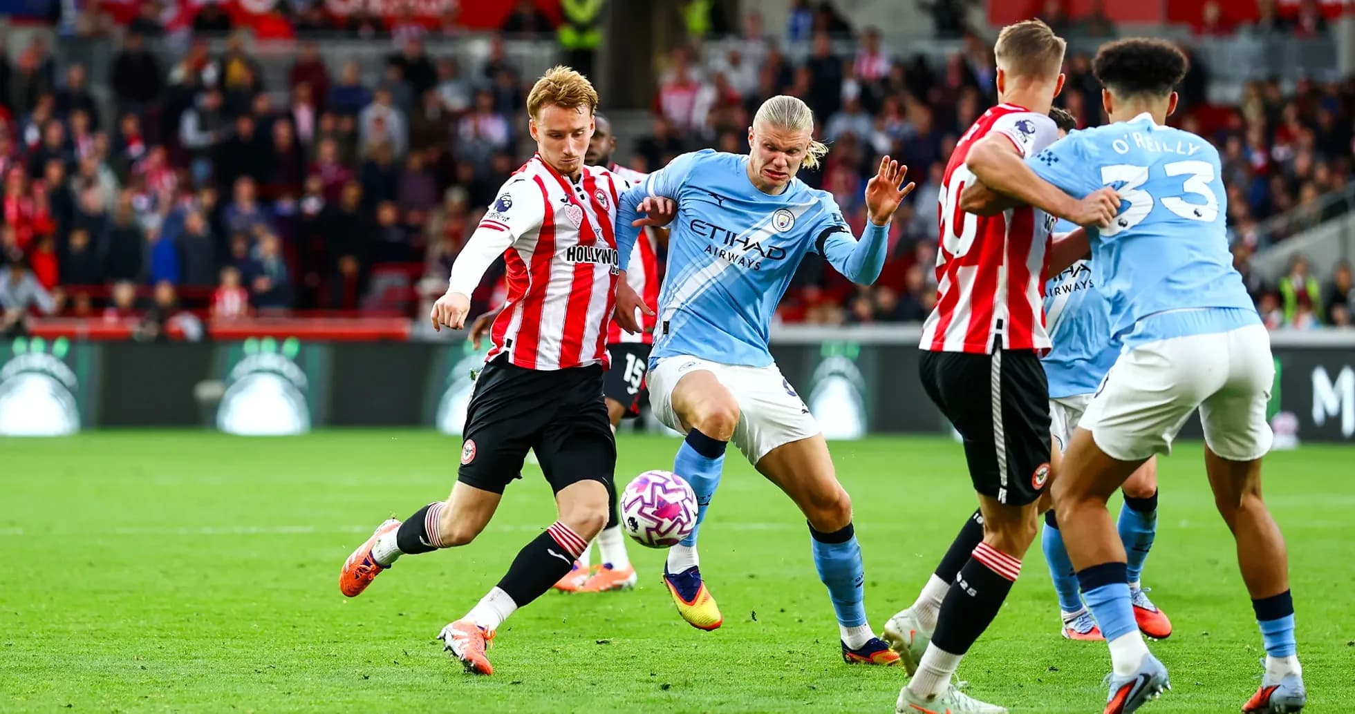 Players contesting the ball in Premier League match