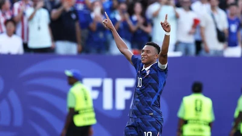 Player celebrating goal with fans in background