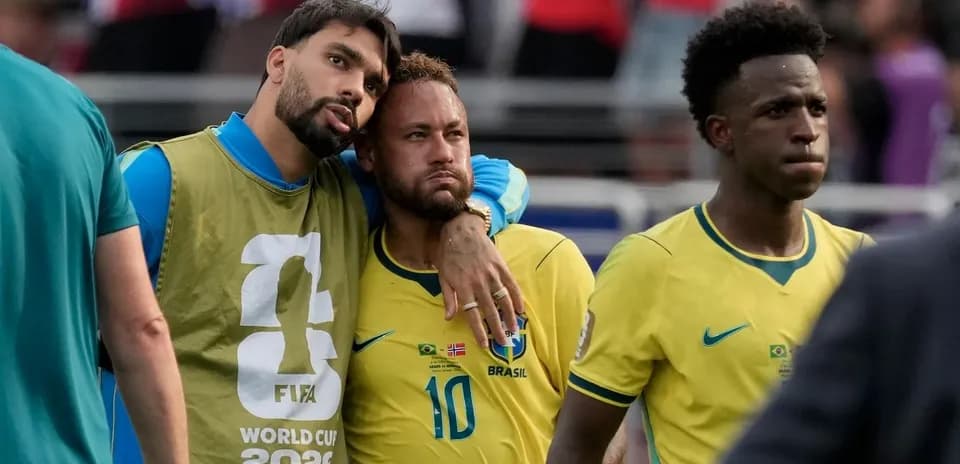 Brazilian players on the sidelines after match