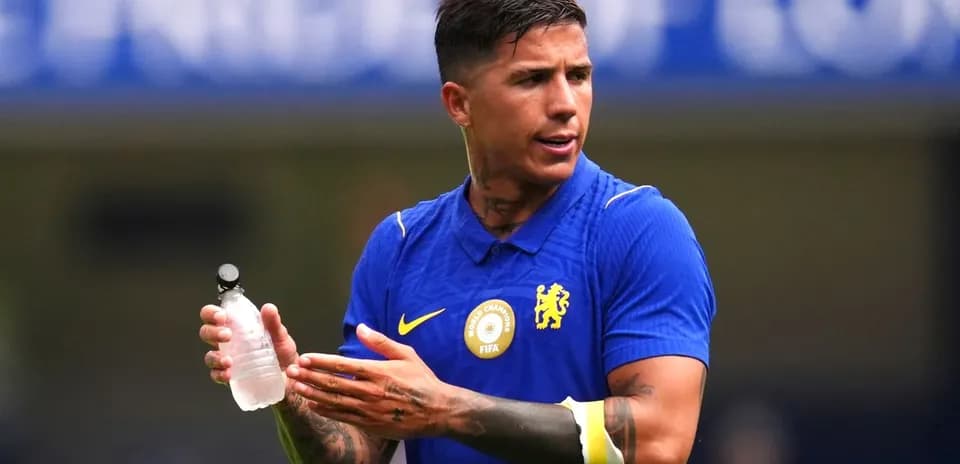 Player holding water bottle during match warm-up