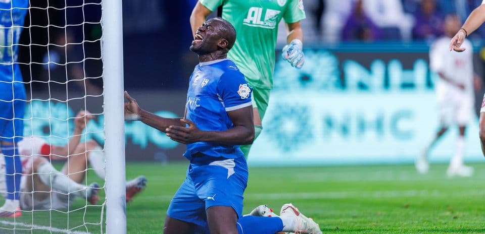Player on knees near goalpost after missing shot
