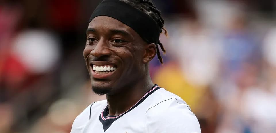 Player smiling during a match on the field