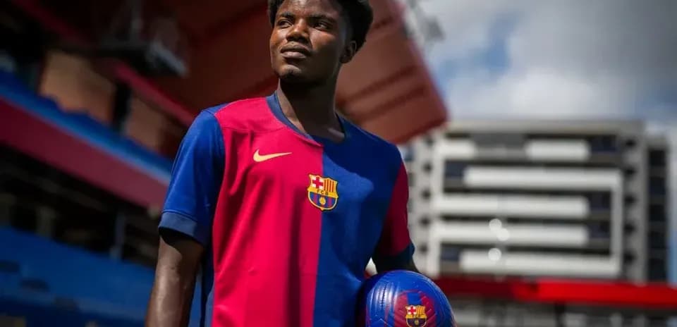 Player posing with ball in Barcelona kit