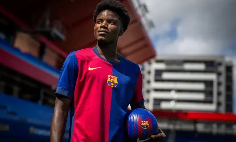 Player posing with ball in Barcelona kit