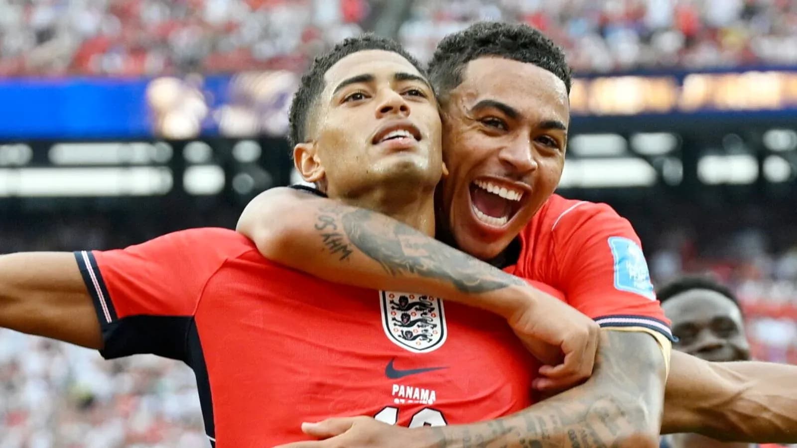 Two players celebrating a goal during match