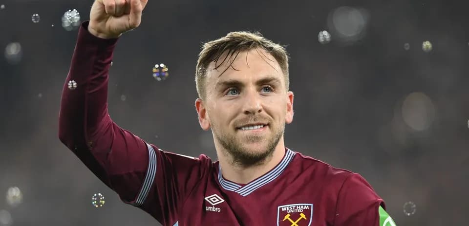 Player celebrating with raised fist at stadium
