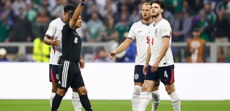 Referee shows yellow card to England player