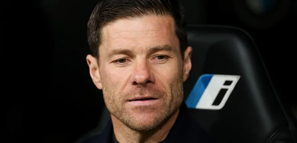 Coach sitting on bench during match