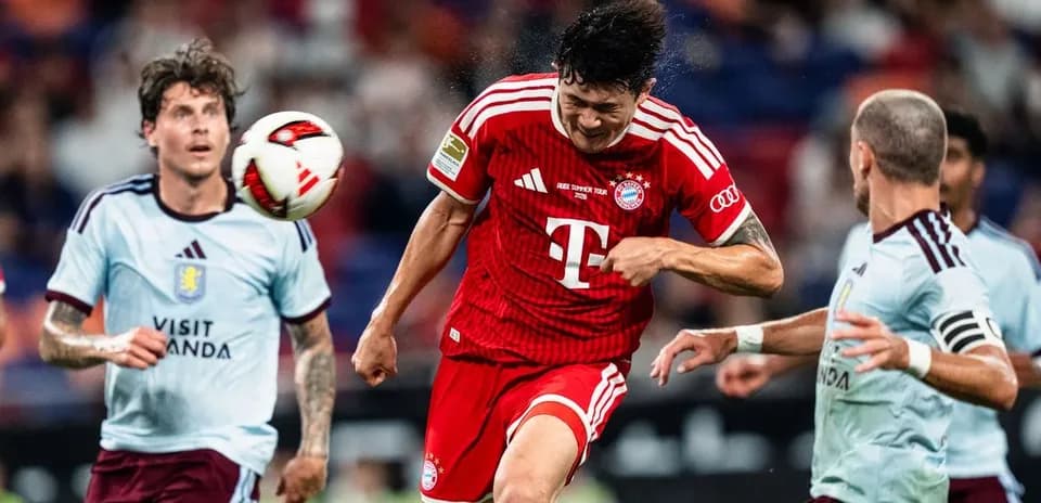 Player heading the ball during a match action