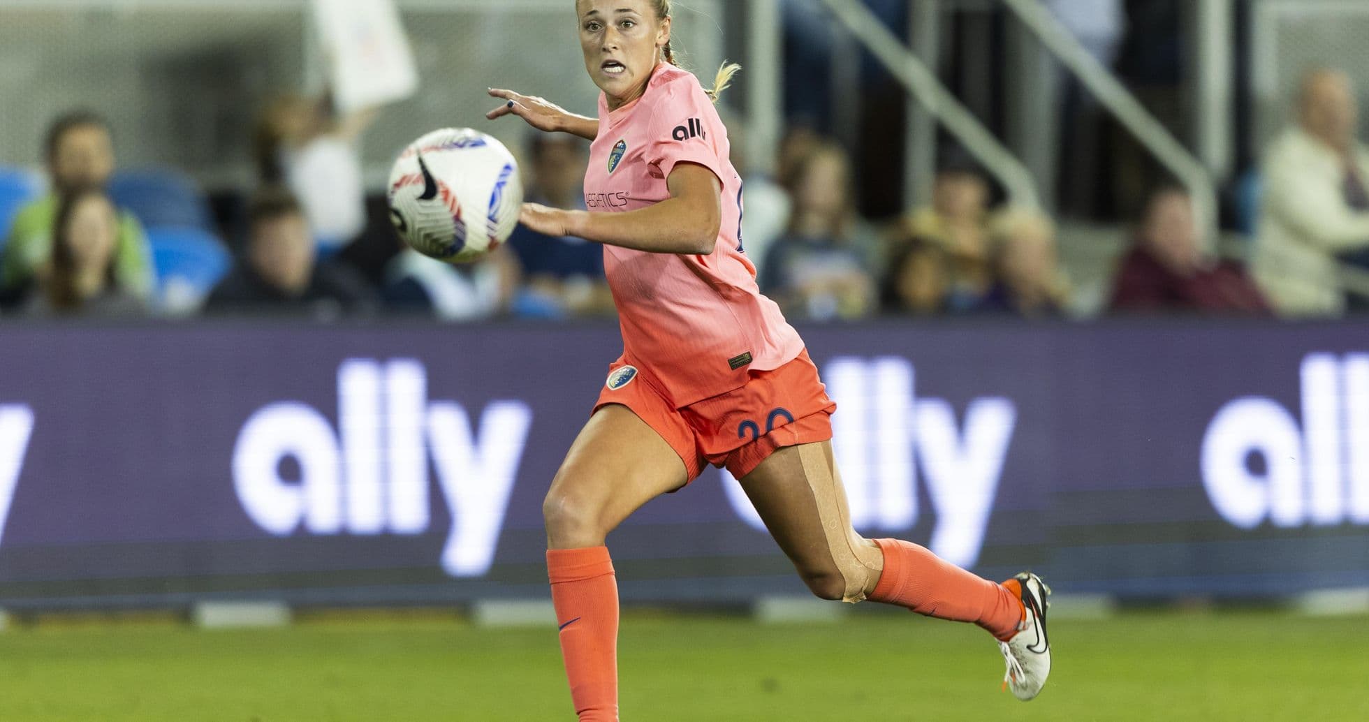 Player running with ball during match