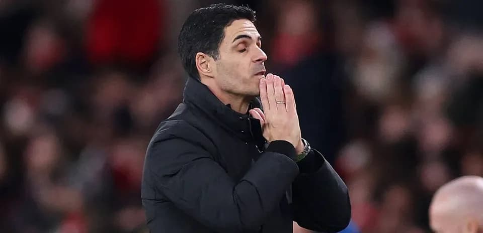 Manager gesturing during a tense moment in match