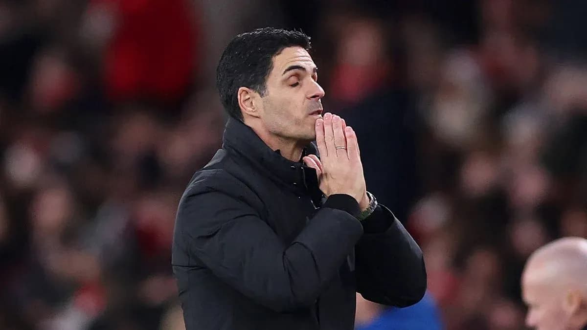 Manager gesturing during a tense moment in match
