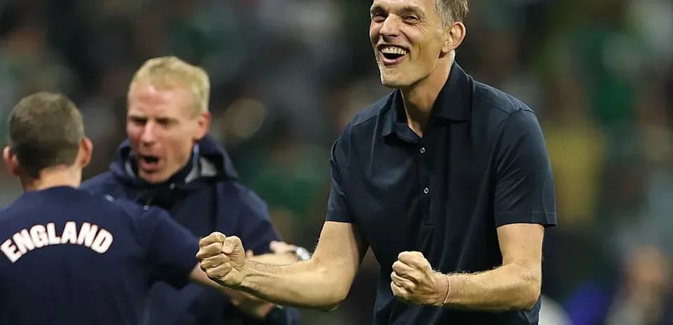 Coach celebrating with staff after a victory