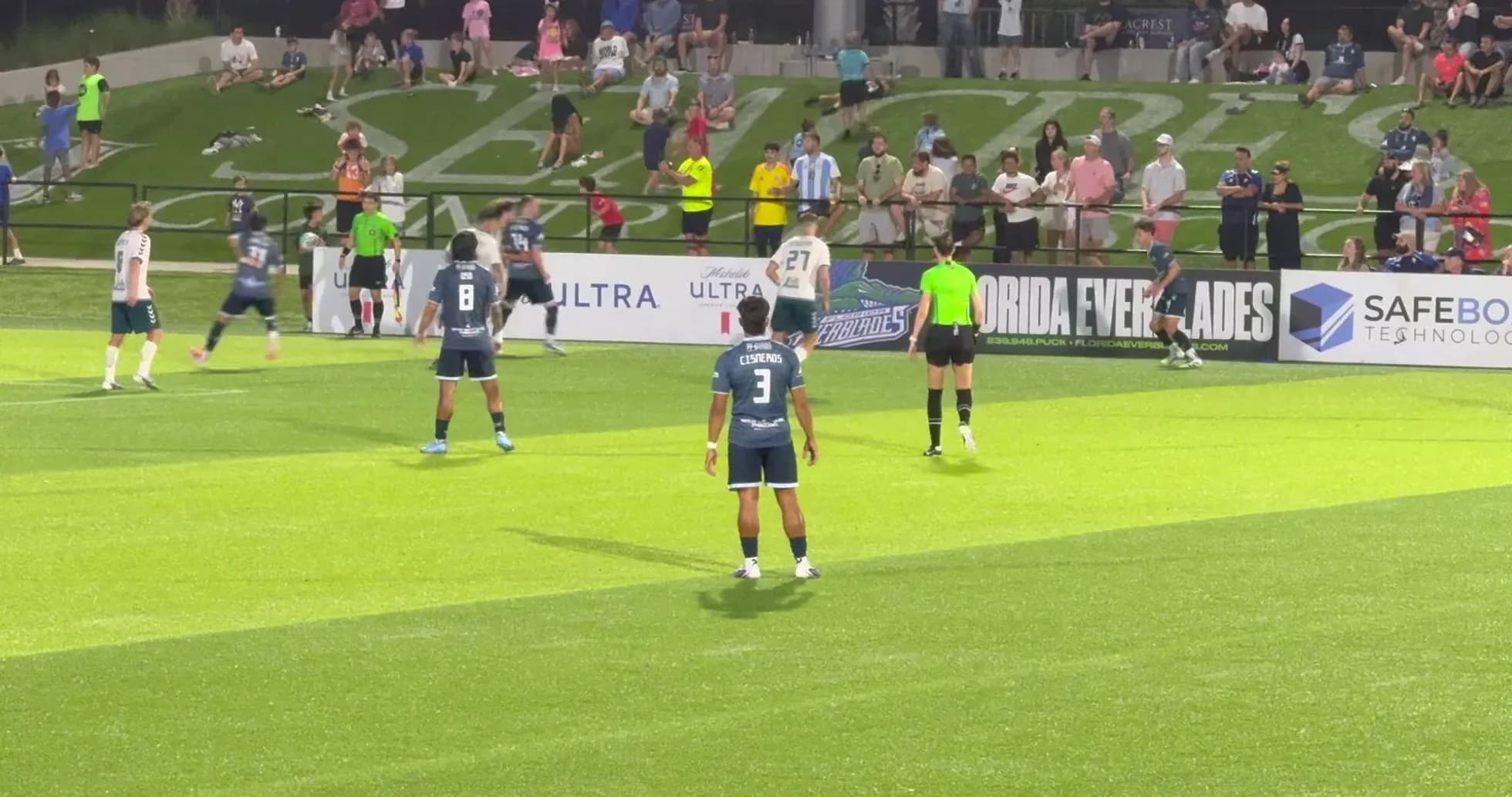 Players on field during Naples vs Sarasota match