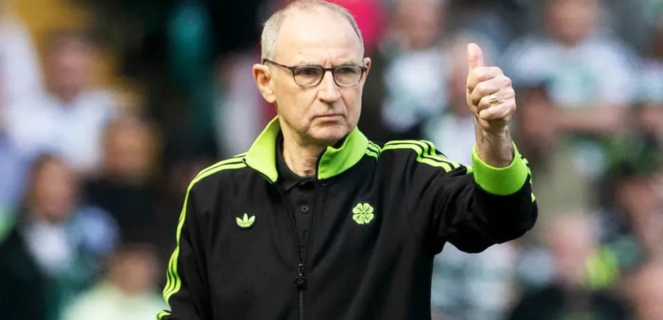 Manager giving thumbs up during match