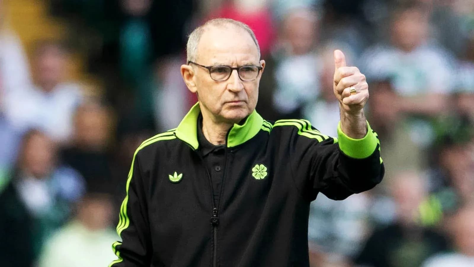Manager giving thumbs up during match