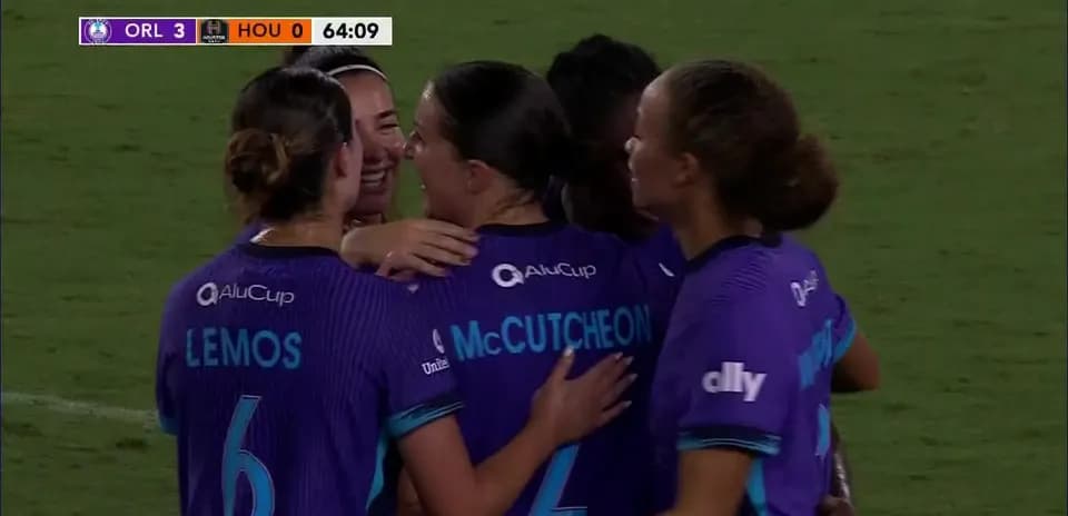 Orlando Pride celebrating a goal against Houston Dash