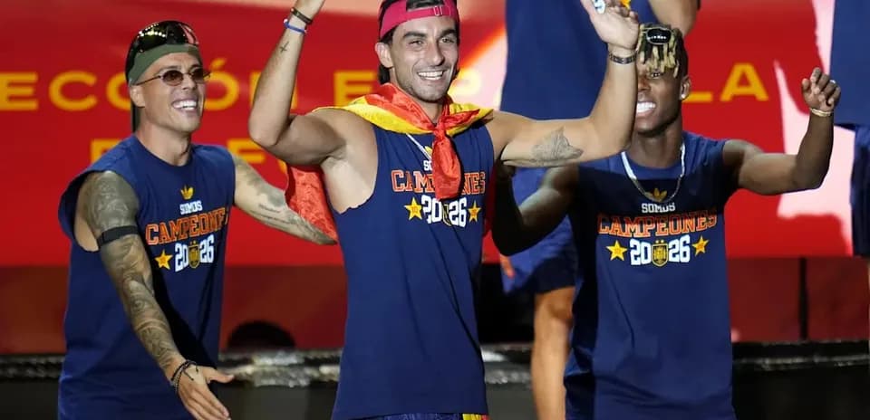 Players celebrating with a trophy at event