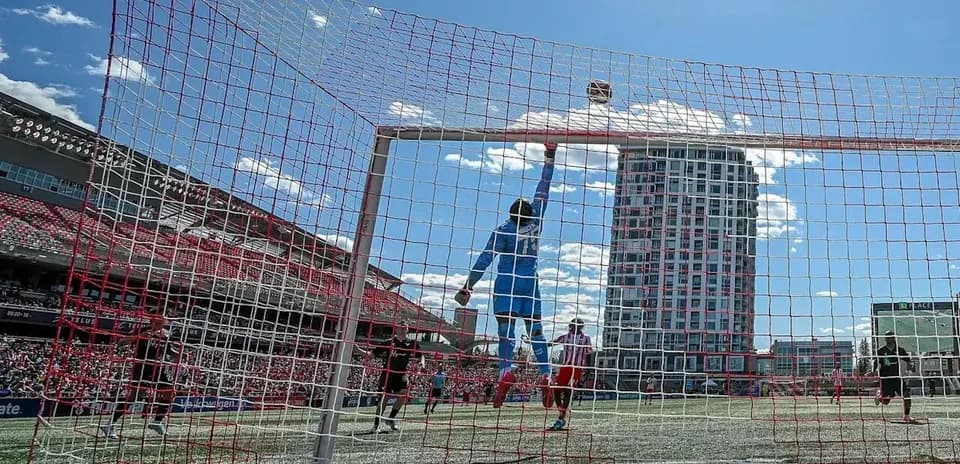 Goalkeeper making a save during match