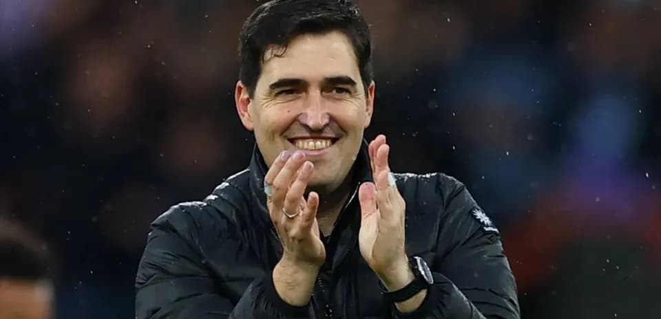 Coach applauding during a match celebration