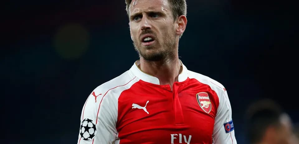 Arsenal player in red kit during match
