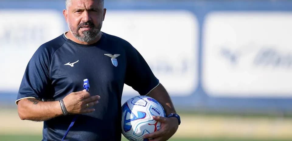Coach holding a soccer ball during training session