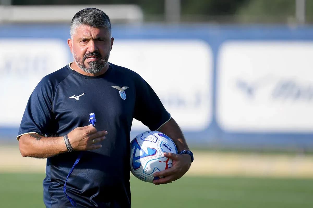 Coach holding a soccer ball during training session
