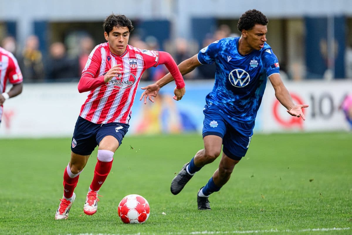 Player running with ball during Atlético Ottawa match