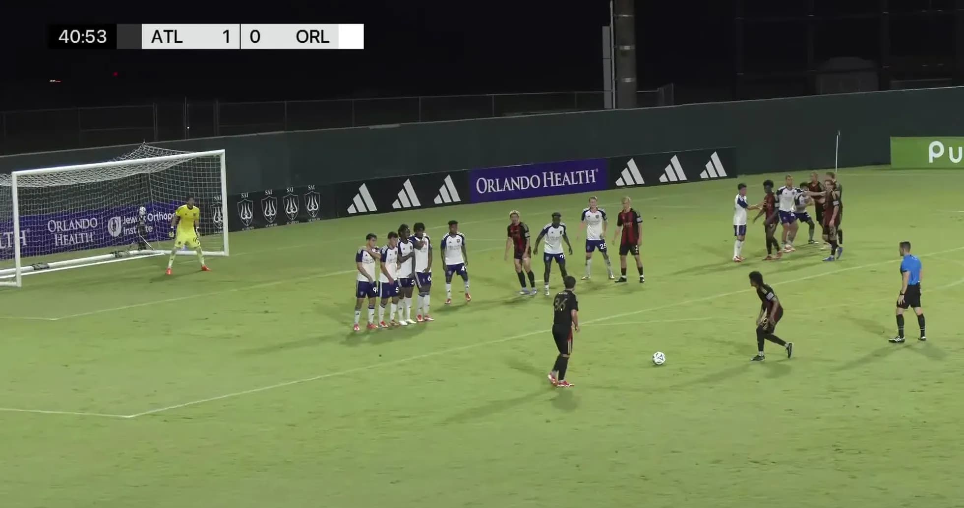 Player preparing to take free kick during match