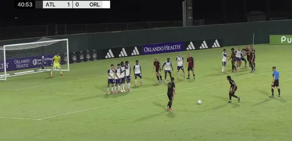 Player preparing to take free kick during match