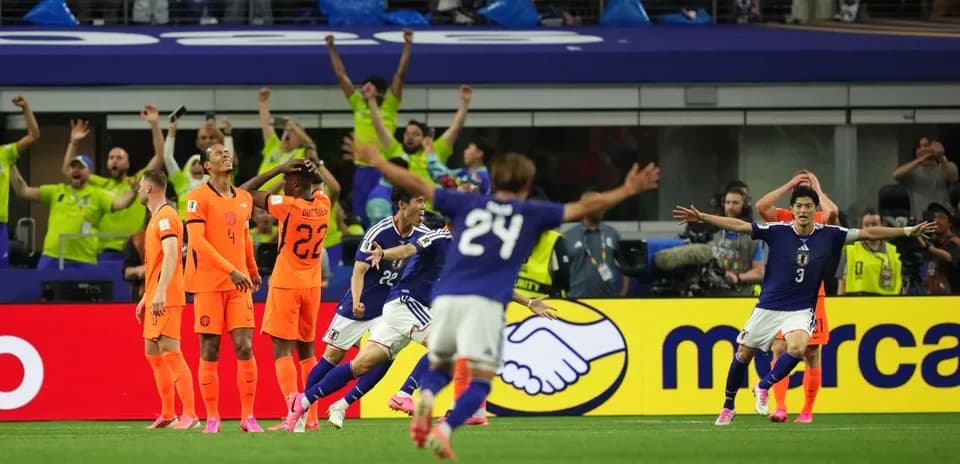 Japanese players celebrating goal against Netherlands