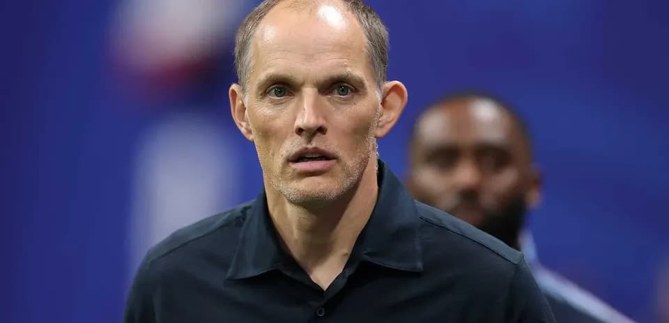 Coach standing on the sidelines during match