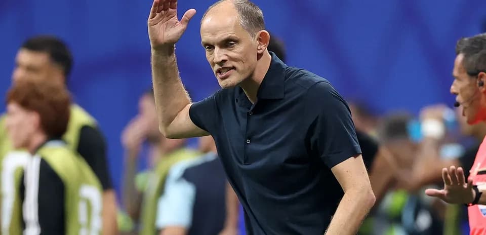 Coach gesturing during a match from the sidelines