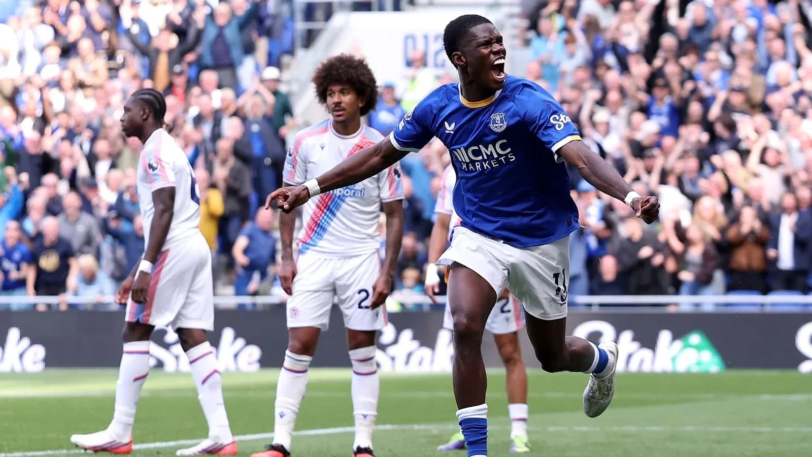 Player celebrating goal with fans in background