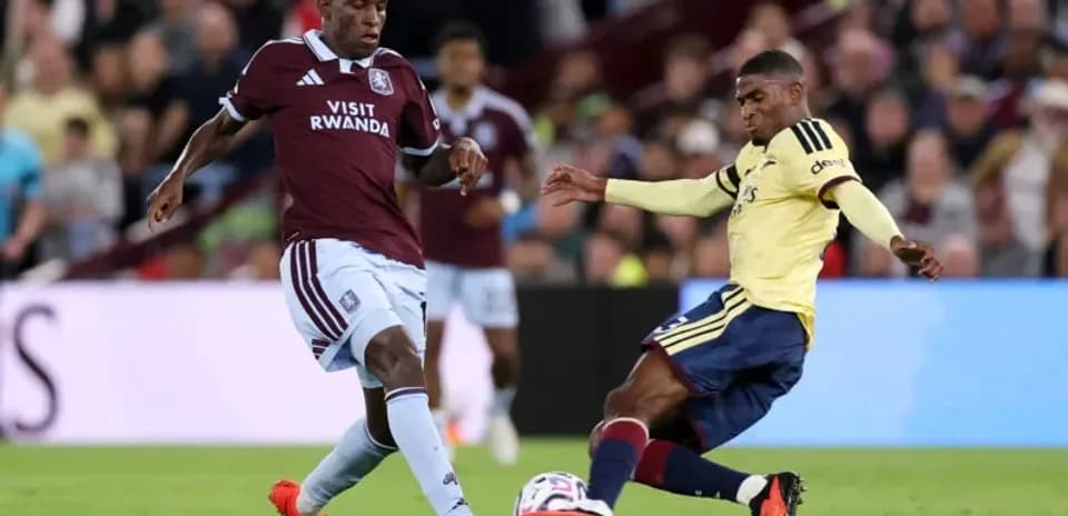 Two players contesting for the ball during match