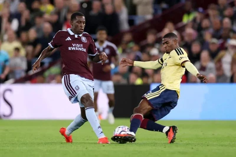 Two players contesting for the ball during match