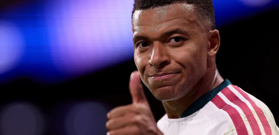 Player giving thumbs up during match celebration