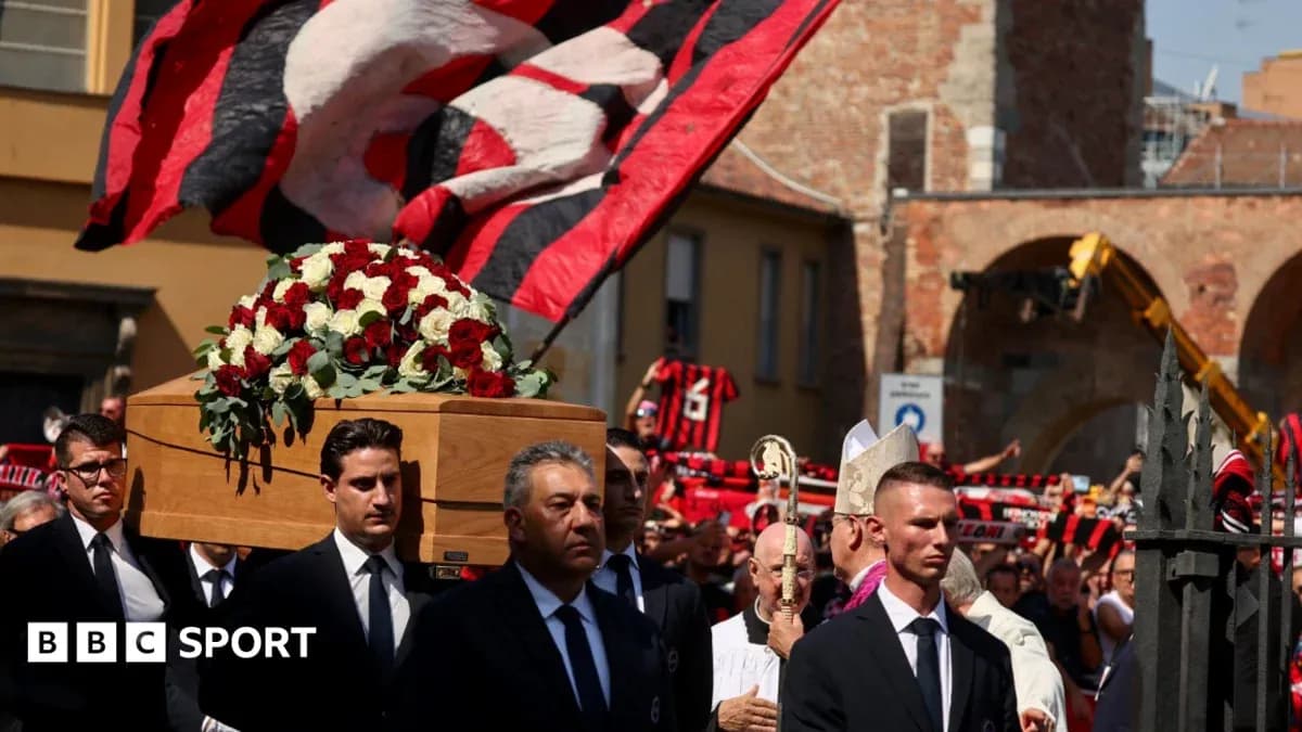 Funeral procession with coffin and supporters in background