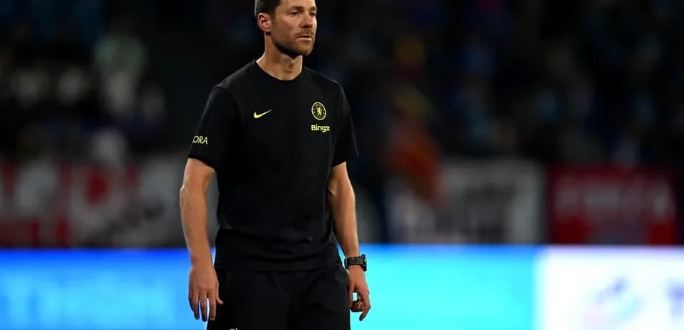 Coach in team uniform during a match