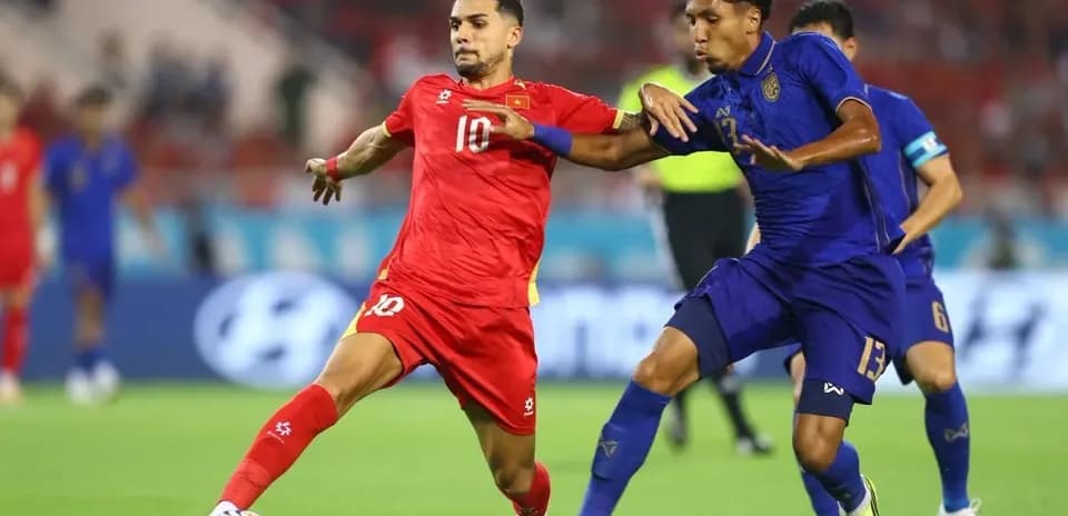 Two players challenging for the ball during match