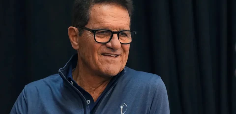 Man smiling while wearing a blue jacket